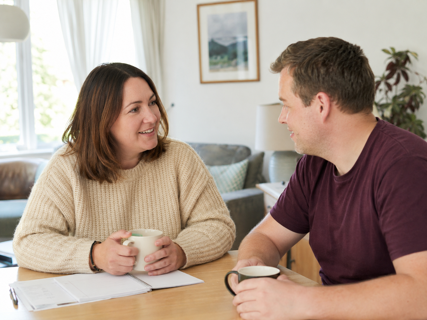 Two people planning support together in a homely setting